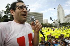 American Apparel owner Dov Charney speaks during a May Day rally protest march for immigrant rights, in downtown Los Angeles